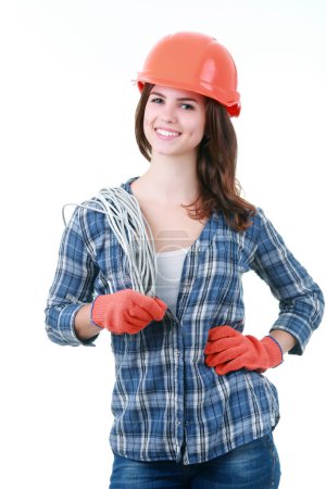 Photo for "Builder woman holds an electric wire" - Royalty Free Image