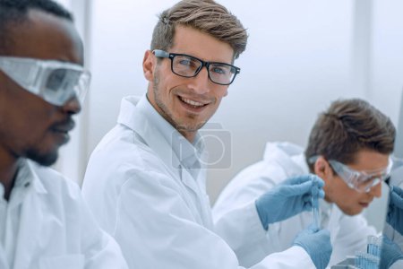Photo for Promising scientist working on a computer in the laboratory - Royalty Free Image