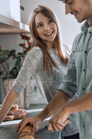 Photo for "happy young couple enjoying cooking Breakfast together." - Royalty Free Image