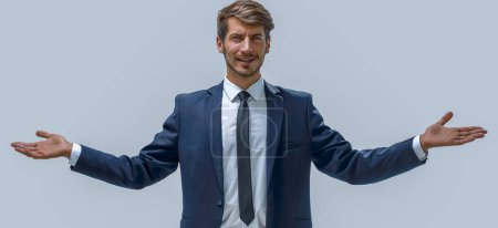 Photo for "the man stands and spreads his hands" - Royalty Free Image