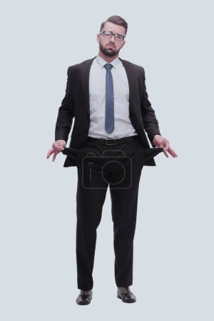 Téléchargez les photos : "en pleine croissance. homme d'affaires frustré montrant ses poches vides
" - en image libre de droit