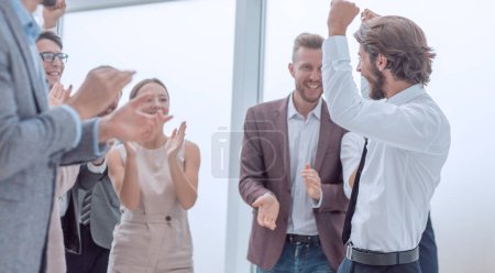 Photo for Corporate group of employees congratulating each other on the victory - Royalty Free Image