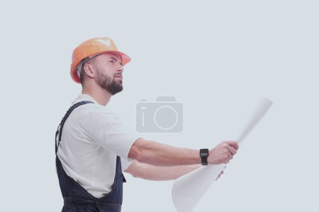 Photo for Competent foreman Builder looking at drawings. isolated on white - Royalty Free Image