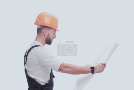 Photo for "competent foreman Builder looking at drawings. isolated on white" - Royalty Free Image