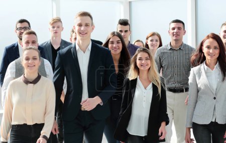 Photo for "group of ambitious young people walking in a new office" - Royalty Free Image