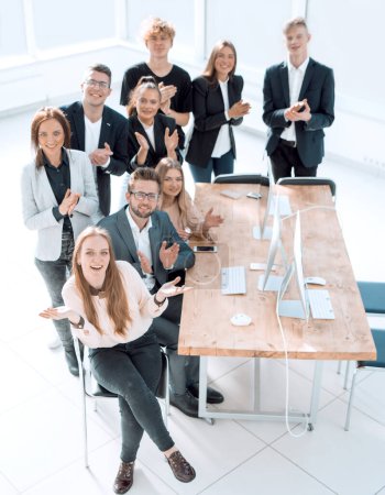 Photo for "top view. a group of happy employees in the workplace." - Royalty Free Image