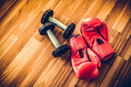 Photo for Red boxing gloves on a wood background. - Royalty Free Image