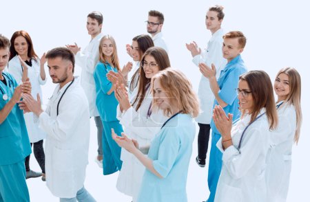 Photo for "large group of doctors supported their success with applause" - Royalty Free Image