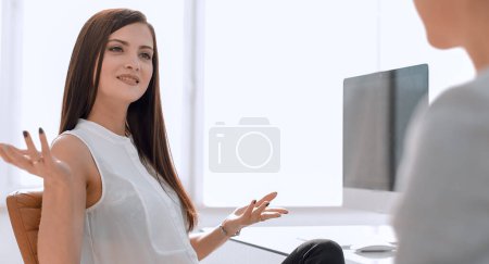 Photo for Two business women talking in the workplace - Royalty Free Image