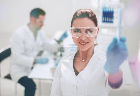 Photo for "successful scientist showing the results of the experiment" - Royalty Free Image