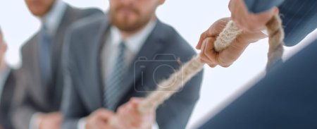 Photo for "image is blurred.the tug of war between business people." - Royalty Free Image