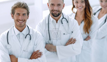 Photo for "Portrait of medical team standing with arms crossed in hospital" - Royalty Free Image
