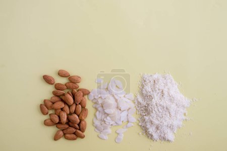 Photo for "almonds, flakes and flour made from it. top view" - Royalty Free Image