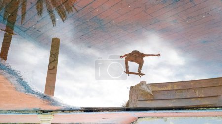 Photo for Reflection of a jumping skater - Royalty Free Image