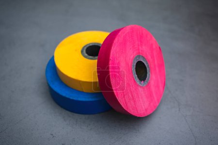 Photo for Three rolls of electrical tape on a dark background - Royalty Free Image