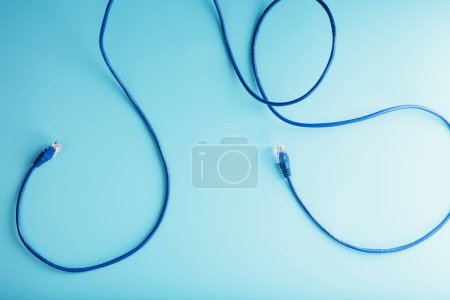 Foto de Blue UTP Internet Cable Isolated on a blue background Ethernet Cord - Imagen libre de derechos