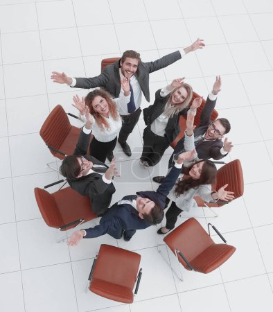 Photo for "view from the top. business team with their hands up." - Royalty Free Image