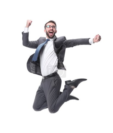 Téléchargez les photos : Heureux jeune homme d'affaires célébrant la victoire ou le succès en sautant sur fond blanc - en image libre de droit