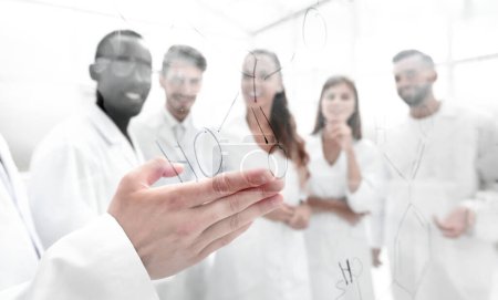 Photo for Gay biologists are discussing a formula that is written on the board - Royalty Free Image
