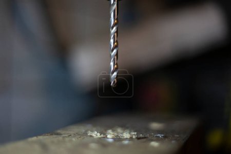 Photo for "Drill for metal. Drilling machine is in the workshop. Handwork in the garage." - Royalty Free Image