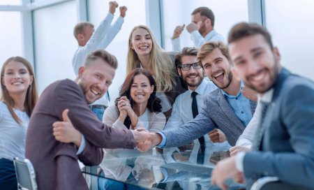 Photo for "happy business people shaking hands in the conference room" - Royalty Free Image