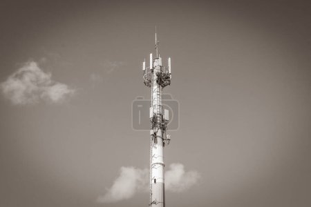 Photo for "Red white 5G tower radiation in Playa del Carmen Mexico." - Royalty Free Image