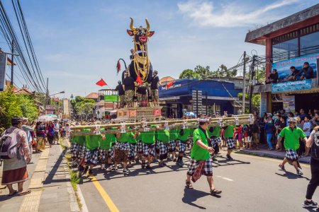 Photo for "Ubud, Bali, Indonesia - April 22, 2019 : Royal cremation ceremony prepation. Balinese hindus religion procession. Bade and Lembu Black Bull symbol of transportation for the spirit to the heaven" - Royalty Free Image
