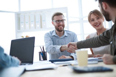 Photo for "business partners shaking hands at the meeting in the office" - Royalty Free Image