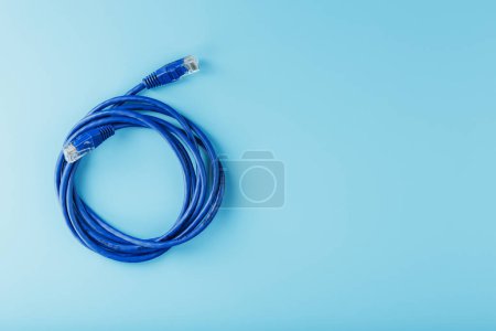 Foto de "Blue UTP Internet Cable Isolated on a blue background Ethernet Cord" - Imagen libre de derechos