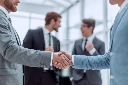 Photo for Business partners shaking hands in the office - Royalty Free Image