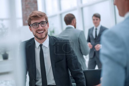 Photo for Smiling young businessman at the workplace office. - Royalty Free Image
