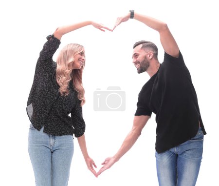 Téléchargez les photos : En pleine croissance. un jeune couple aimant faire un cœur hors de leurs mains - en image libre de droit