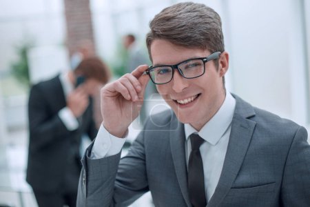 Photo for Responsible business man looking through his glasses. - Royalty Free Image