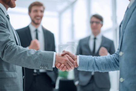 Photo for Business partners shaking hands in the office - Royalty Free Image