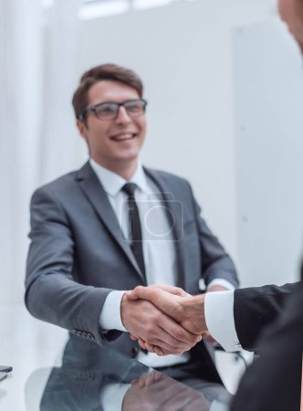 Photo for "happy business people shaking hands in the office." - Royalty Free Image