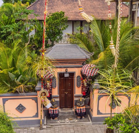 Photo for "Door to the Balinese house decorated for the ceremony" - Royalty Free Image