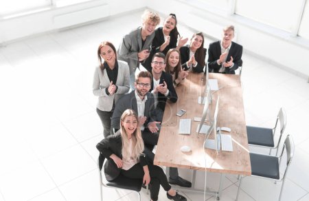 Photo for "top view. portrait of a happy business team near the desktop." - Royalty Free Image