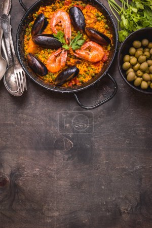 Photo for Paella on table background, close up - Royalty Free Image