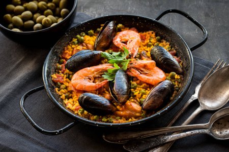 Paella on table background, close up