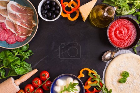 Photo for "Pizza and ingredients background" - Royalty Free Image