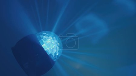 Téléchargez les photos : Color, RGB ball of color music shines with laser beams in the disco smoke - en image libre de droit