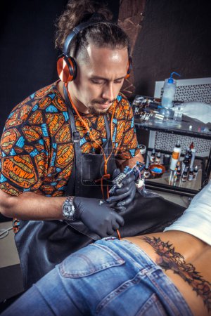 Photo for Professional tattooer posing in tattoo studio - Royalty Free Image