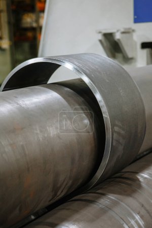 Photo for A sheet of iron that passes through the bending machine. Automation - Royalty Free Image