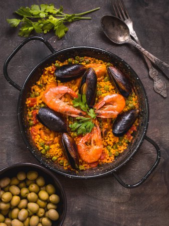 Photo for "Paella on a table" - Royalty Free Image