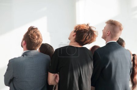 Photo for Rear view. a group of young business people looking at a blank screen. - Royalty Free Image