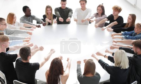 Photo for "group of young people in a teambuilding class" - Royalty Free Image