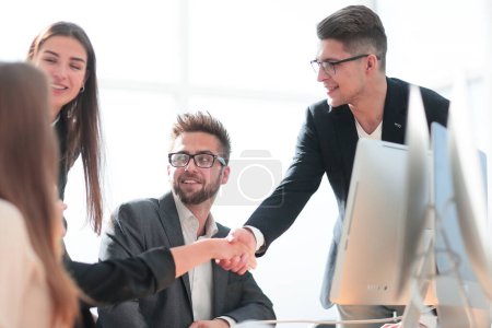Photo for Business colleagues shaking hands with each other in the workplace in the office - Royalty Free Image