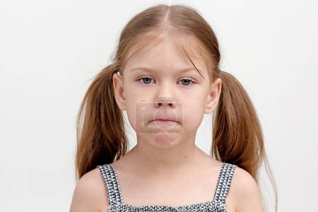 Photo for "Child pursing tense lips" - Royalty Free Image
