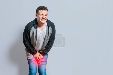 Photo for "Person with urinary problems, Medical problem urinary incontinence. people with crotch pain, Man with hands on crotch with urinary problems" - Royalty Free Image