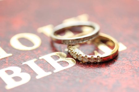 Photo for "Diamond wedding rings on background, close up - Royalty Free Image